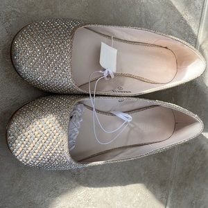 Pink/nude flats from David’s bridal. Pearl and crystal sparkles.